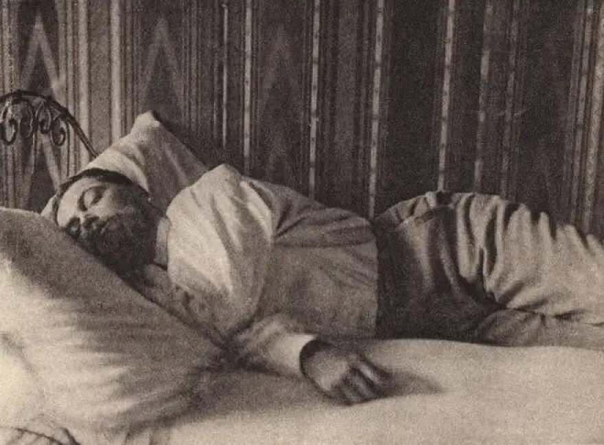 A rare photograph captures Claude Debussy taking a nap in 1900.