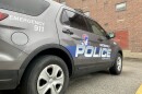 An angled close up of a gray Moberly police SUV. The car also has the logo of the Spartans on it, the Moberly School District mascot. 