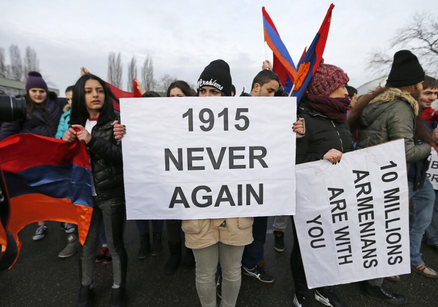 An Armenian protester holds a sign reading "1915 never again" during a demonstration near the European Court of Human Rights in Strasbourg, France, on Jan. 28.