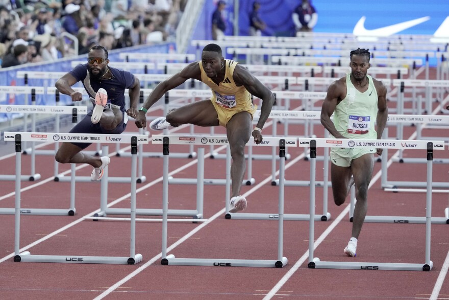 Chesapeake's Grant Holloway, center, is one of four athletes with ties to Hampton Roads representing the U.S. in the upcoming summer Olympics.