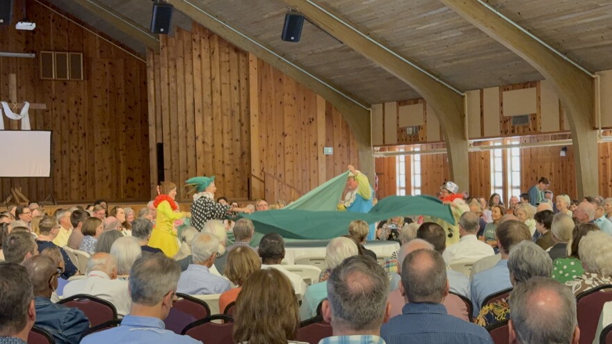 Clowns prepare the altar for the afternoon's service.