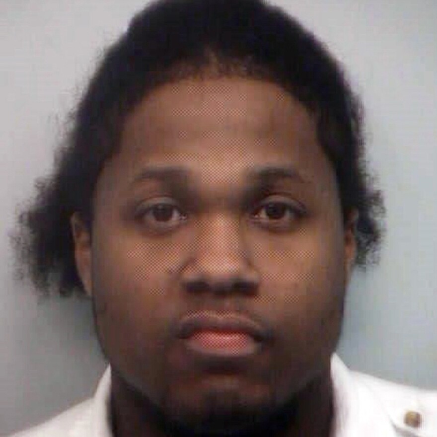This 2010 booking photo provided by the Fulton County, Ga. Sheriff's office shows Ismaaiyl Brinsley after he was arrested on charges of terroristic threats, simple battery and marijuana possession.