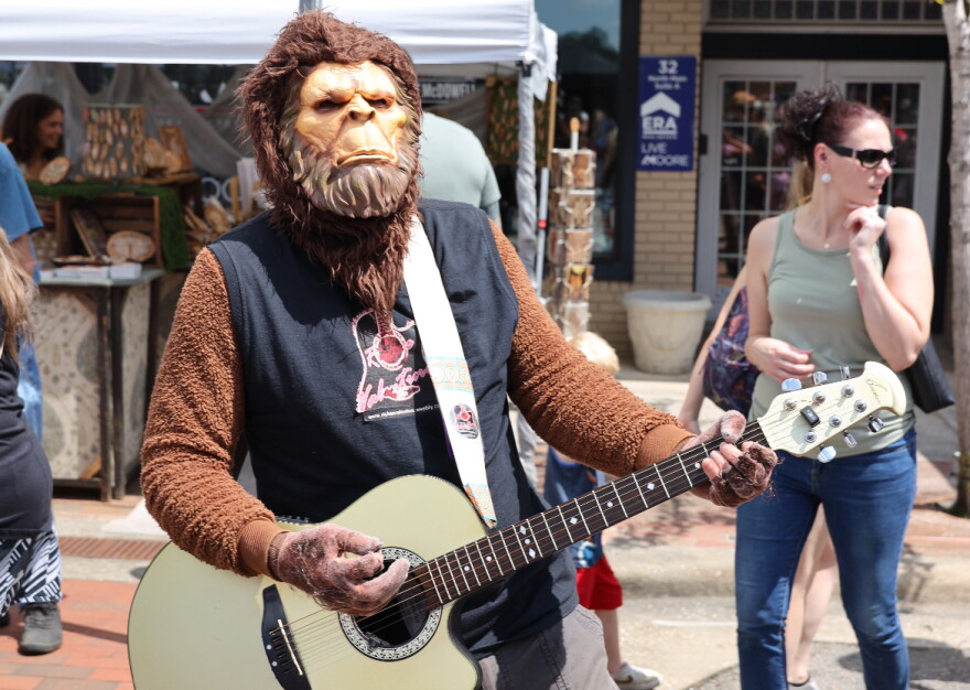 Bigfoot playing acoustic guitar