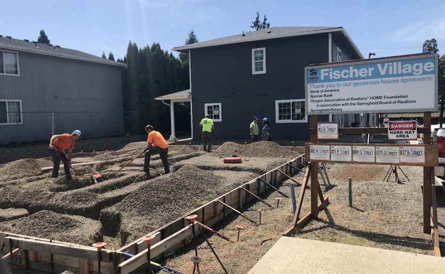 Workers in 2022 building the now completed Fischer Village low-income housing complex in Springfield