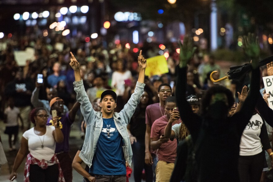 Demonstrators fill a downtown city street during protests on Wednesday night in Charlotte, NC. The protests began the previous night following the fatal shooting of 43-year-old Keith Lamont Scott at an apartment complex near UNC Charlotte.