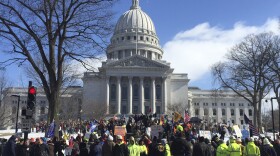 Hundreds of union members rally outside the Capitol in Madison on Tuesday to oppose a Republican-led measure that would make Wisconsin a right-to-work state.