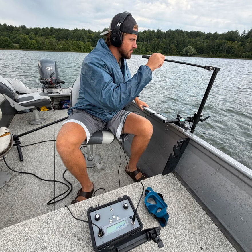 Bemidji State University undergraduate student Jake Stauber searches for muskies on Leech Lake.