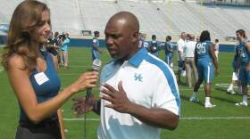 Maria Montgomery interviews University of Kentucky football coach Joker Phillips as part of her work for vaughtsviews.com