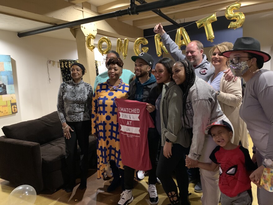 Jamel Hill and his family celebrating after they found out Hill will be going the University of Kentucky for physical medicine and rehabilitation residency.