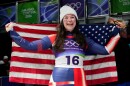 United States' bronze medlist Ashley Farquharson celebrates after the women's single luge competition at the 2026 Winter Olympics, in Cortina d'Ampezzo, Italy, Tuesday, Feb. 10, 2026. (AP Photo/Alessandra Tarantino)