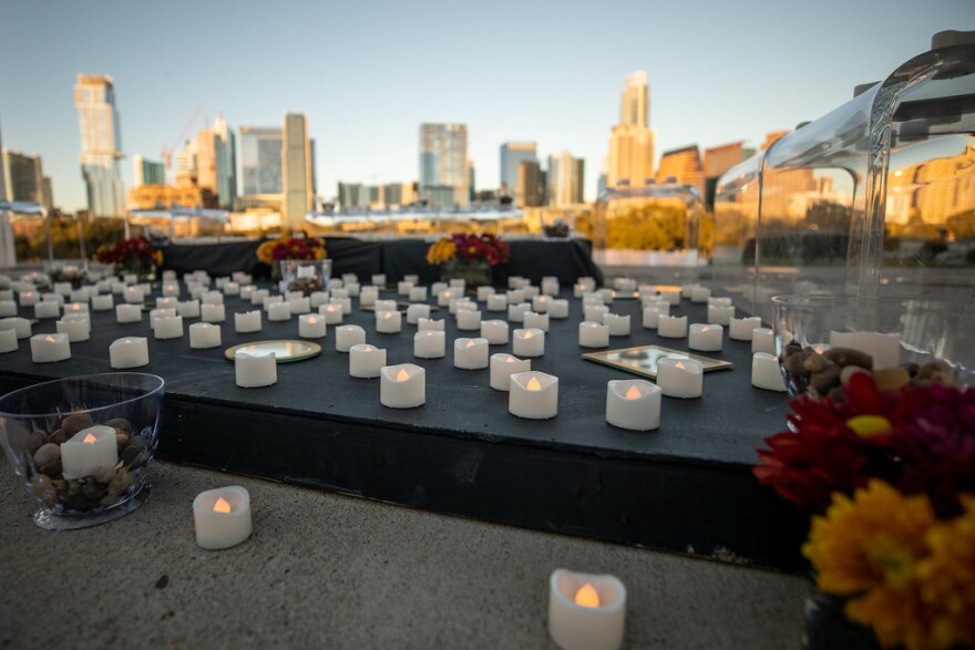 Candles set up at the Long Center in October memorialize people who lost their lives to COVID-19 in Travis County