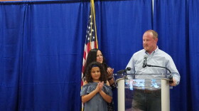 Fort Myers native, Matt Caldwell, gives a speech at his election watch party in North Fort Myers Tuesday night with his wife Yvonne and his 10-year-old daughter, Ava, by his side.