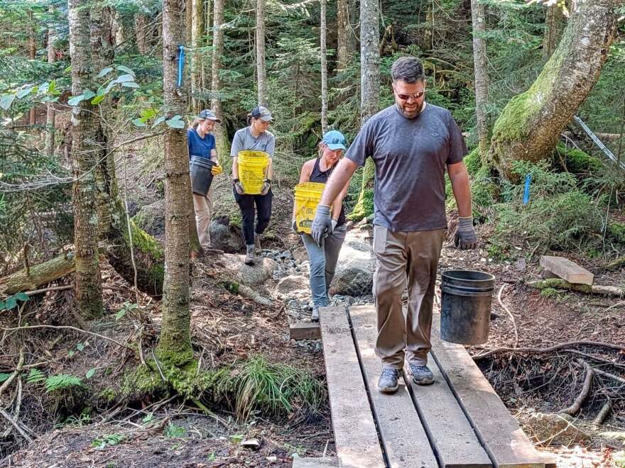Volunteers with the ADK 46ers trail crew in July 2026 helping repair the Avalanche Pass trail.