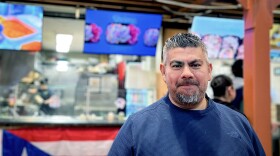 Enrique Rodrigez of Amston, a neighborhood in Hebron, CT, stands in front of Mofongo inside Parkville Market in Hartford, Connecticut on November 10th 2025. He owns the Puerto Rican eatery, as well as Fowl Play. He also opened Las Tortas MX and Burrito Loko inside the marketplace. Rodriguez said he covers the cost of tariffs so his customers don't have to. “For now, we want to take care of the people,” Rodriguez said.