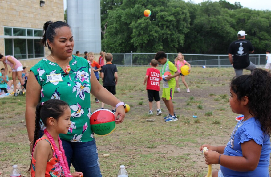 Teena Sannicolis-Tanner watches her daughter Lo’Ani eat lunch with her friend Nevaeh at Comal ISD's Garden Ridge Elementary on the last day of school May 30, 2019.