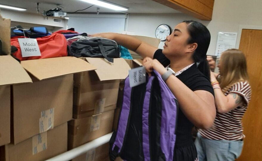 The Sioux City Community School District handed out hundreds of donated backpacks filled with school supplies on Monday.