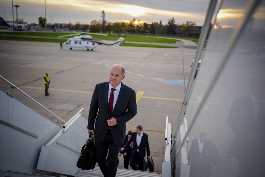 German Chancellor Olaf Scholz arrives at Berlin-Brandenburg Airport for his flight to China on Thursday.