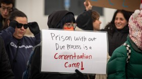 A sign held by a demonstrator at a protest against a potential Immigration and Customs Enforcement detention center in north Salt Lake City, Jan. 16, 2026.