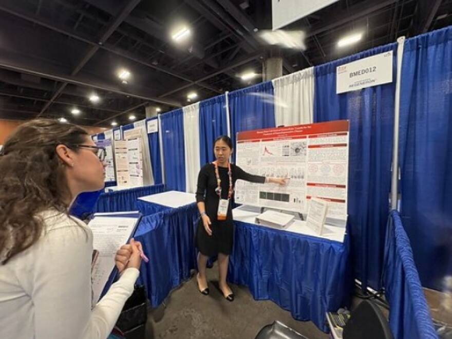 Lily Ma explains her research to judges at this year's Regeneron International Science and Engineering Fair in Phoenix, Arizona.