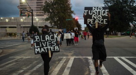 Protesters march during a demonstration against police brutality in Charlotte, North Carolina, on September 21, 2016, following the shooting of Keith Lamont Scott the previous day.
(Nicholas Kamm/AFP via Getty Images)
