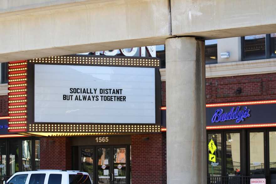 building marquee that says "socially distant but always together"