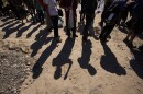 Migrants wait to be processed by the U.S. Customs and Border Patrol after they crossed the Rio Grande and entered the U.S. from Mexico. 