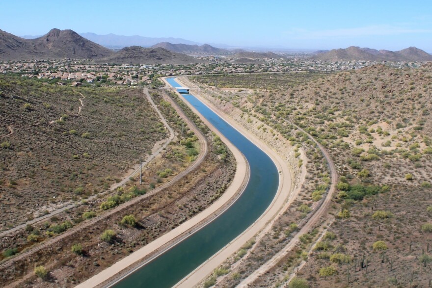 The Central Arizona Project canal carries Colorado River water through the Phoenix area on March 26, 2026. Arizona officials had harsh words for a new federal plan that could cut deep into the canal's water supply.