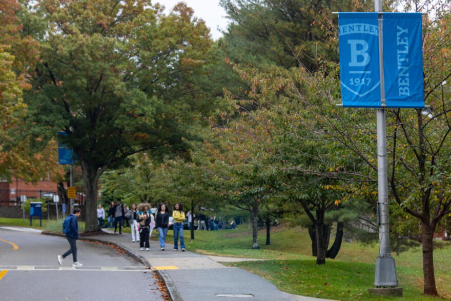 Students walk through the campus at Bentley University. (Jesse Costa/WBUR)