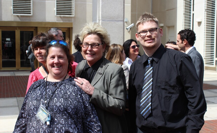 APD Director Barbara Palmer poses with advocates for the developmentally disabled.