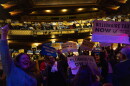 People cheer during a performance by Tom Morello at a campaign event for a proposed "billionaires tax," in Los Angeles, Wednesday, Feb. 18, 2026.