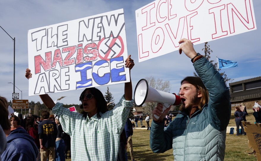 Gabriel Trilling (right), a senior at Flagstaff High School, led students in chants on a bullhorn during a walkout and protest at Flagstaff City Hall on Jan. 28, 2026 in opposition to the Trump administration's intensifying immigration crackdowns.