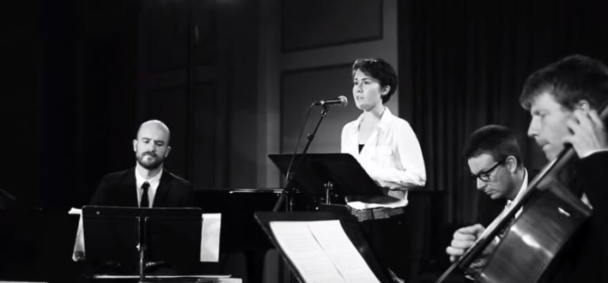 black-and-white photo of Caroline Shaw performing with the Calder Quartet