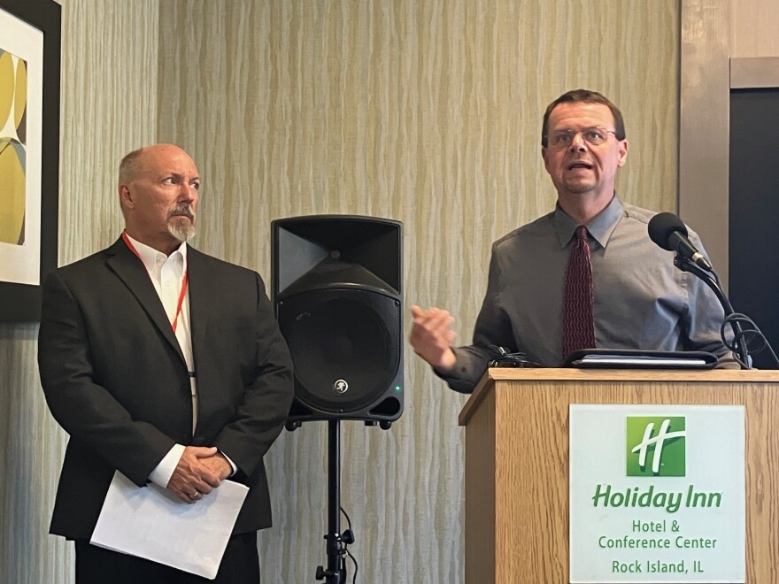Mike Kuehn, right, of the Illinois Department of Transportation, speaks at a media briefing Wednesday, May 20, as Phil Mescher of Iowa Department of Transportation, looks on.