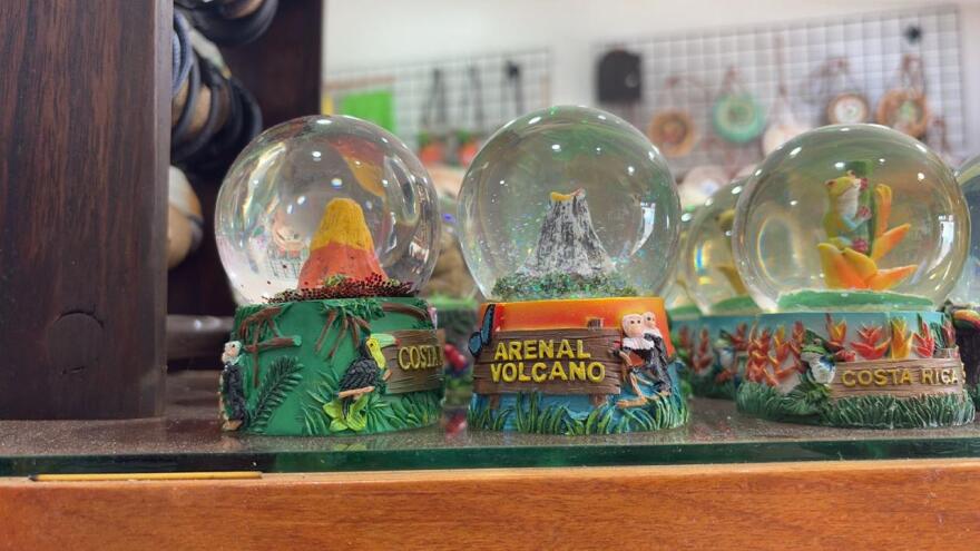 Souvenir snow globes of the Arenal Volcano line the shelves in Lupita Cedeño’s shop. (Courtesy of Lupita Cedeño)