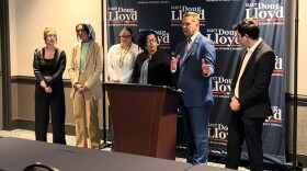Eaton County Prosecuting Attorney, Republican Doug Lloyd (second from the right) criticizes his Democratic opponent in the race for Michigan Attorney General of advocating a policy that "ignores the realities of the sex trade."