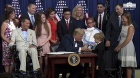 President Donald Trump with Jordan McLinn, 8, of Indianapolis.