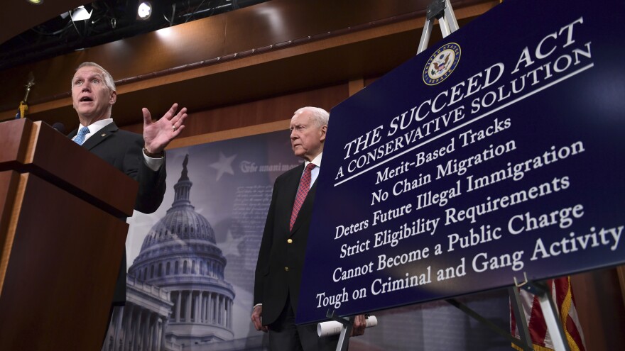 Sen. Thom Tillis, R-N.C., (left) standing with Sen. Orrin Hatch, R-Utah, (right) talk about the SUCCEED Act during a Monday news conference on Capitol Hill. Their proposal is aimed at protecting the legal status of hundreds of thousands of immigrants brought to the country illegally as children.