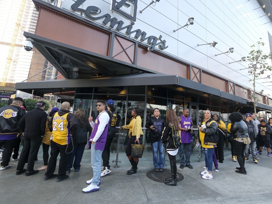 Fans line up to get into the Staples Center to attend a public memorial for former Los Angeles Lakers star Kobe Bryant and his daughter, Gianna, in Los Angeles.