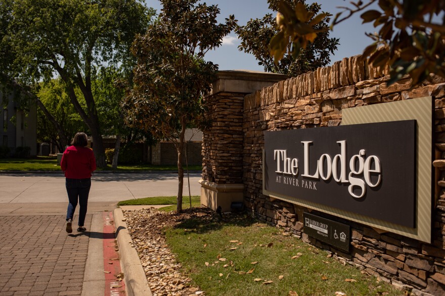 Mona Ogas walks away from The Lodge at River Park. She was evicted by the company that owns the complex, Aragon Holdings, LLC. The company applied for rental assistance funding after a judge gave her five days to move out.