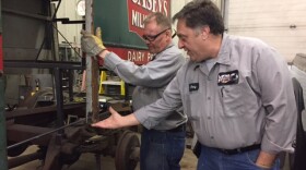 Gary Cloutier (right), at his auto body shop in Westfield, Mass.