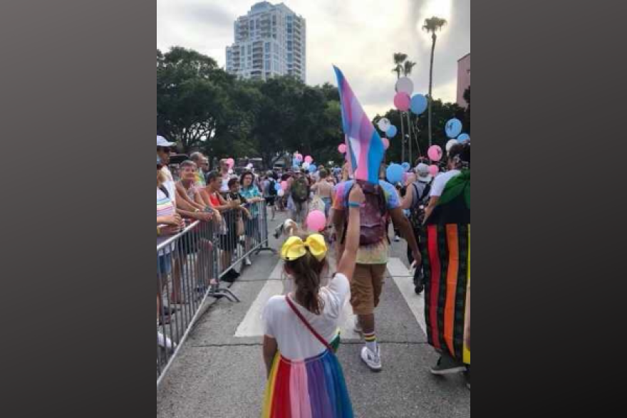 Lindsay McClellan's daughter, marching at the 2019 St. Pete Pride Parade, waving a trans flag. Photo courtesy of Lindsay McClellan