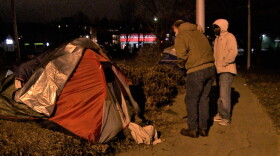Wheeler Mission director Dana Jones offers to bring people camping in Seminary Park back to its shelter on Monday, Jan 11.