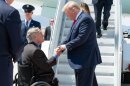 Greg Abbott and former President Trump arriving at El Paso International Airport in 2019.