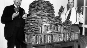 Agents Chris Hansen and H.A. Moodie hold seized opium in Los Angeles on April 22, 1935. Ingeniously hidden under a load of oranges in the rear of an auto driven by a Chinese man, this store of opium, valued at $40,000, was seized by federal narcotic officers. The driver was arrested. (AP)