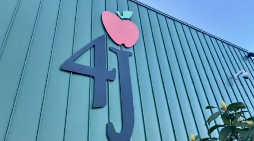 Eugene 4J school building showing the logo of 4J with an apple