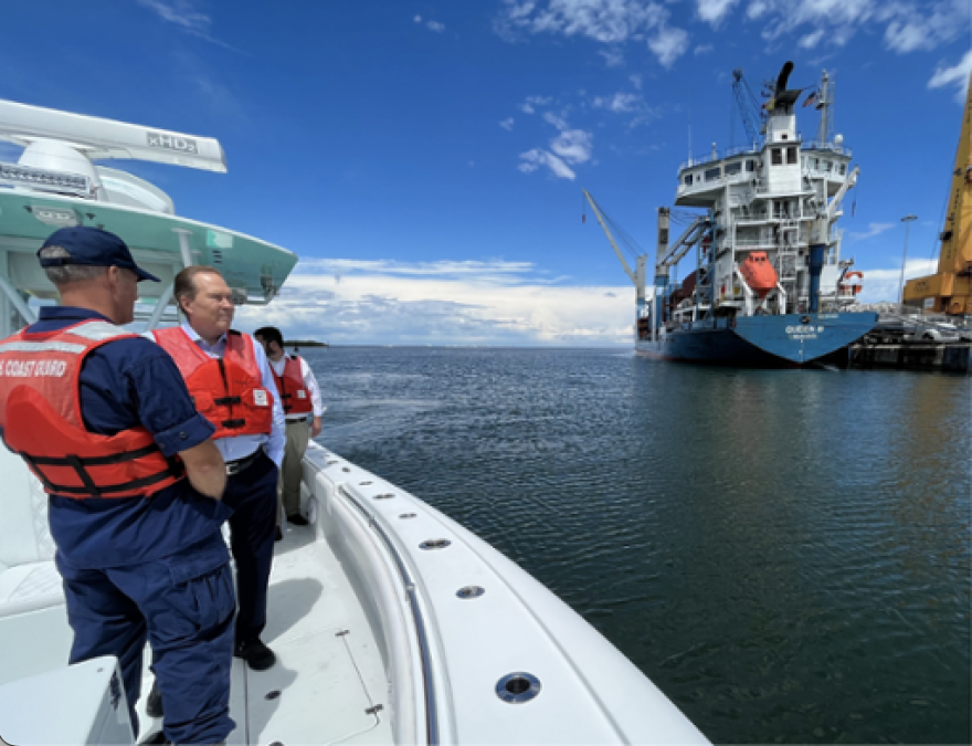 Sarasota Congressman Vern Buchanan examines the oil spill at SeaPort Manatee.