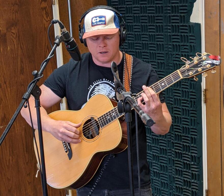 Rob Weimann playing his guitar