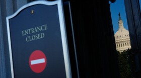The U.S. Capitol is reflected in the doors of the Library of Congress, which is closed due to a partial government shutdown, Wednesday, Oct. 1, 2025, in Washington.