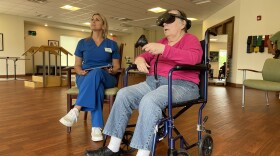 Jean Sprague tries out the MyndVR headset at Stratford Pines nursing and rehabilitation in Midland on June 27.