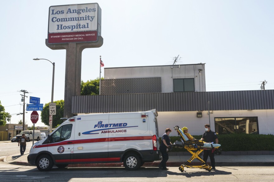 A patient is transported by ambulance outside the Los Angeles Community Hospital in East Los Angeles on Friday, Aug. 4, 2023. Hospitals, including the Community Hospital, and clinics in several states on Friday began the time-consuming process of recovering from a cyberattack that disrupted their computer systems, forcing some emergency rooms to shut down and ambulances to be diverted.